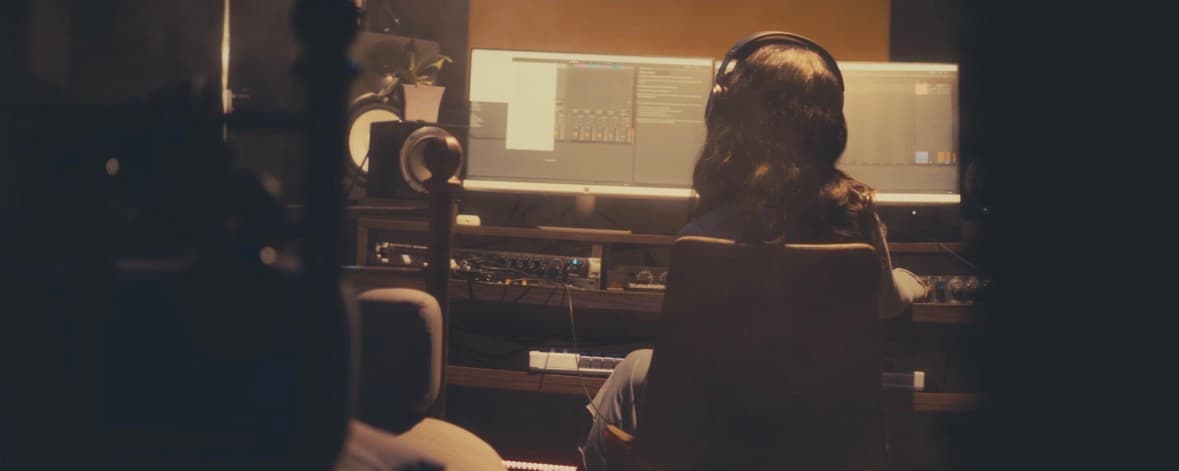 Inside the studio at Acoustika, a producer at the desk